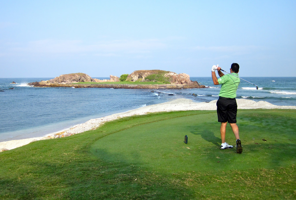 golf player at beach